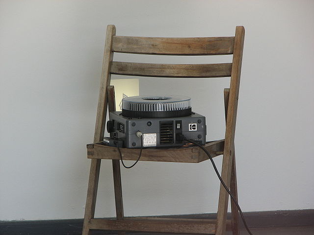 Slide projector on a wooden chair